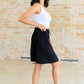 Just a Flirt Pleated Skirt in Black Skirts
