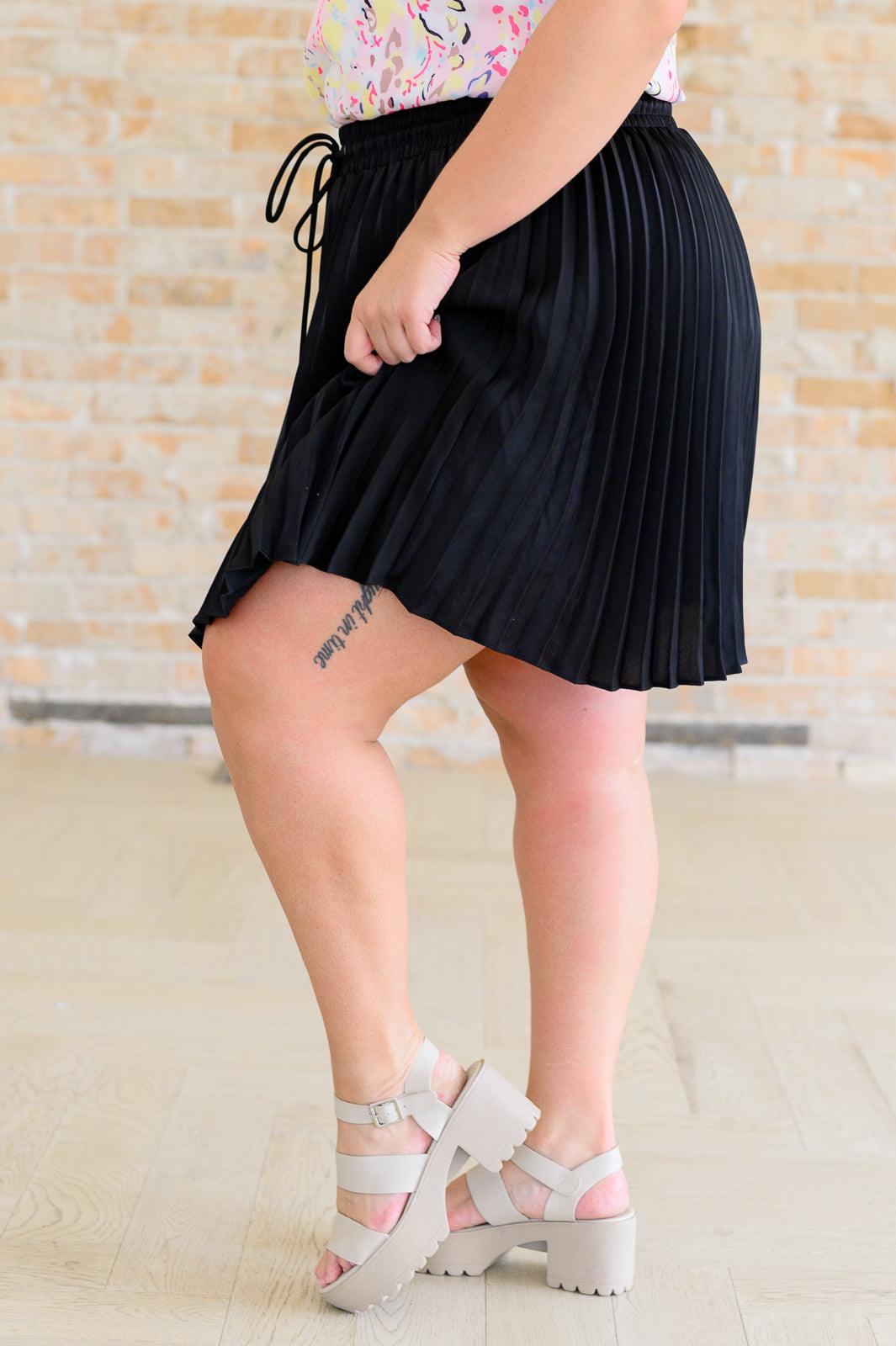 Just a Flirt Pleated Skirt in Black Skirts