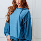 Cozy medium-blue Needs Some Logic Color Block Hoodie with ruffled knit front