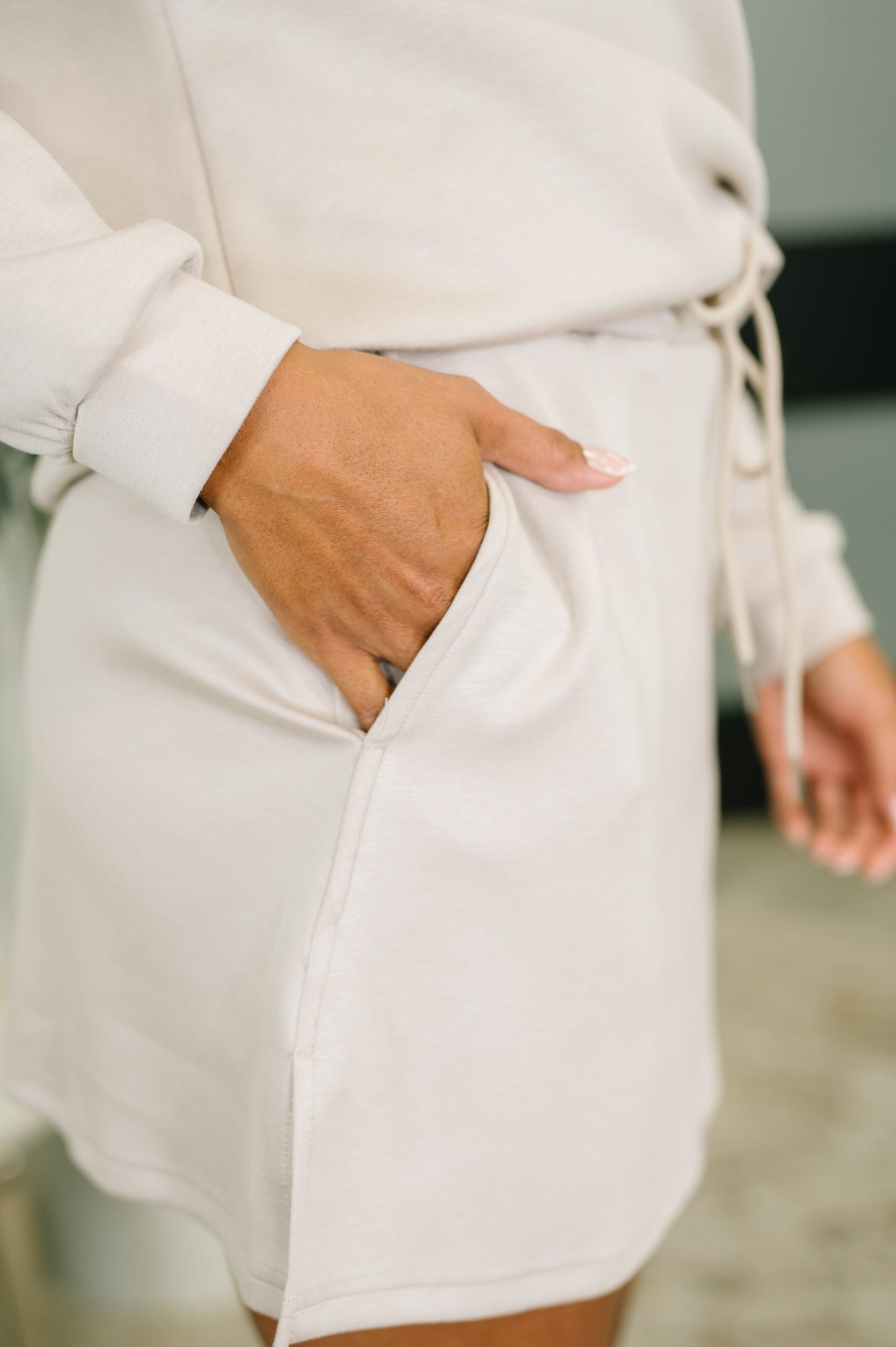 Cream-colored soft fabric skort with drawstring waist and side pockets from Overslept set
