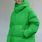 Green pocketed zip-up hooded puffer jacket with quilted design