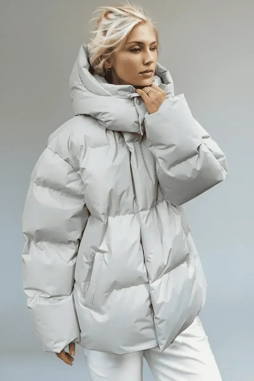 Light gray quilted puffer jacket with hood and pockets