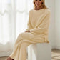 Cream-colored ribbed knit loungewear set with long sleeves and wide-leg pants