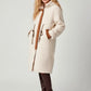 Plus size cream shearling coat with brown leather trim and drawstrings