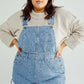 Full-size pocketed square neck wide strap light-wash denim overalls with rolled cuffs