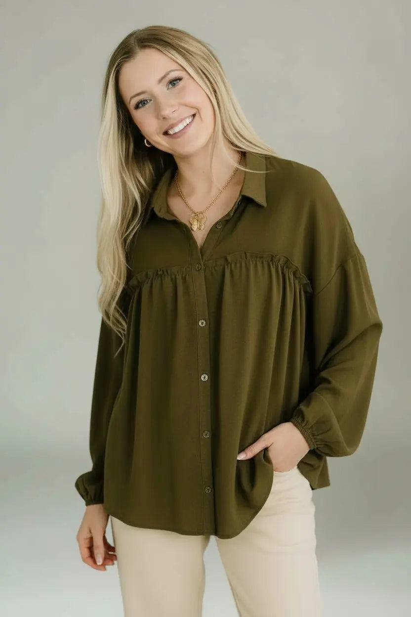 Olive green collared button-down blouse with ruffled neckline and elastic cuffs