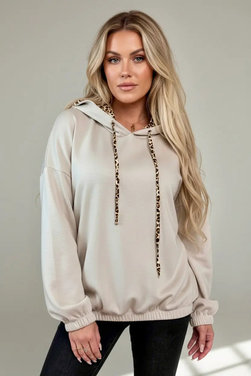 Beige long sleeve hoodie with leopard print drawstrings and ribbed cuffs