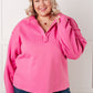 Vibrant hot pink oversized hoodie with relaxed fit, ruched sleeves and collar