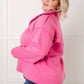Vibrant hot pink oversized cropped jacket with relaxed fit and structured shoulders