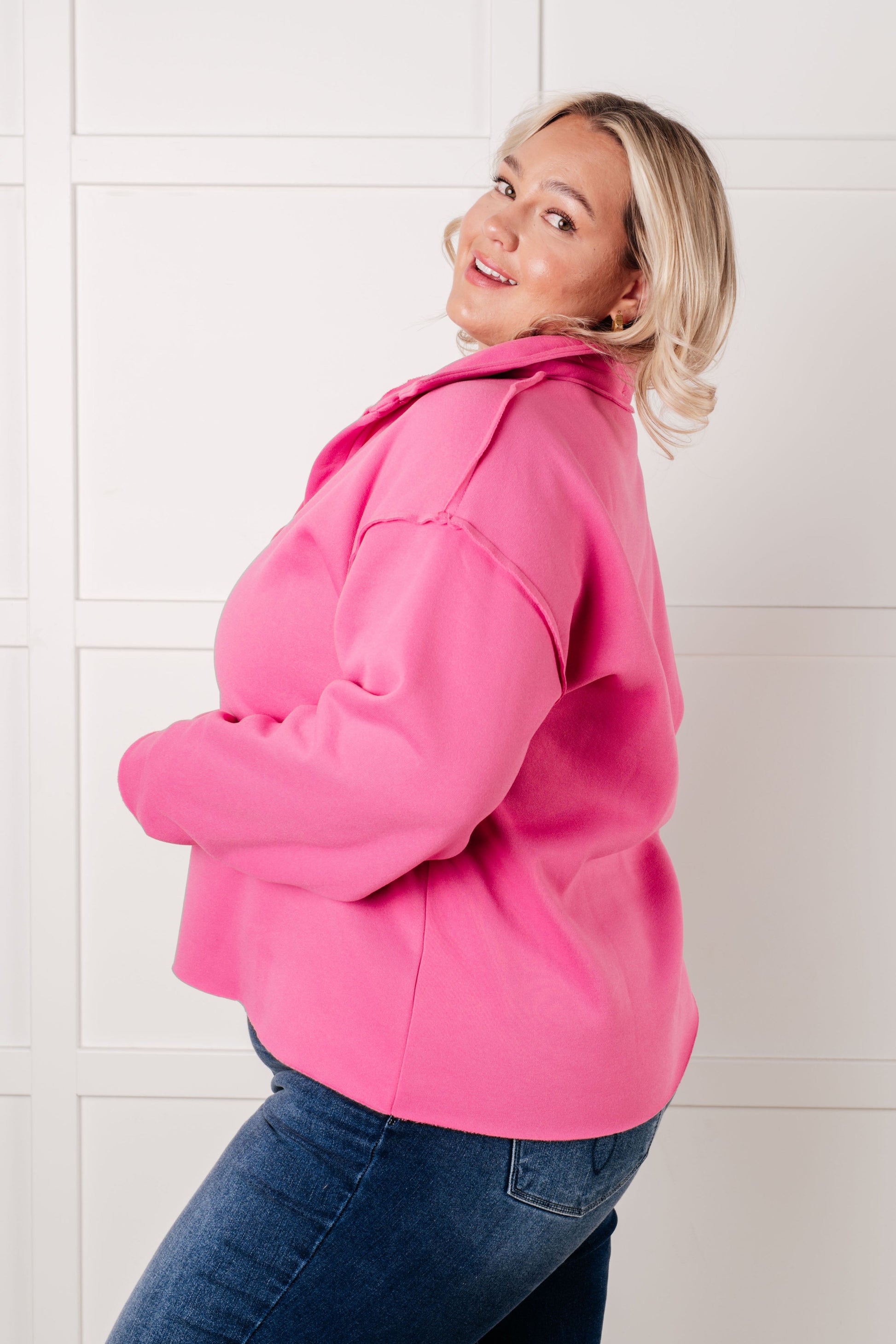 Vibrant hot pink oversized cropped jacket with relaxed fit and structured shoulders