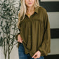 Olive green Shes Got A Way blouse with ruffled hem and button-down front