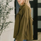 Olive green oversized jacket with ruffles and pockets on blouse