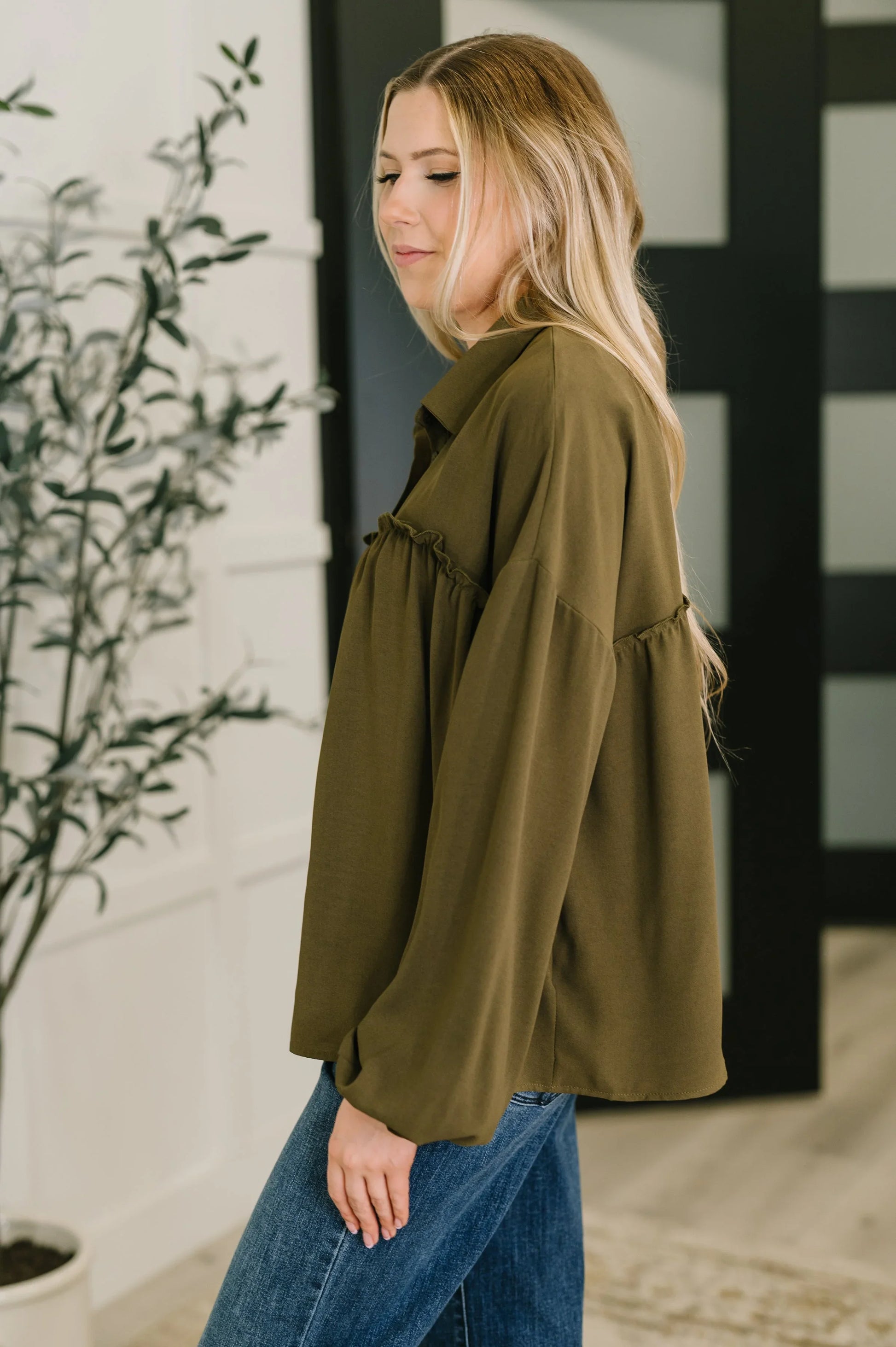 Olive green oversized jacket with ruffles and pockets on blouse