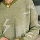 Olive green Shock Value V-neck sweater with white lightning bolt arrow patterns