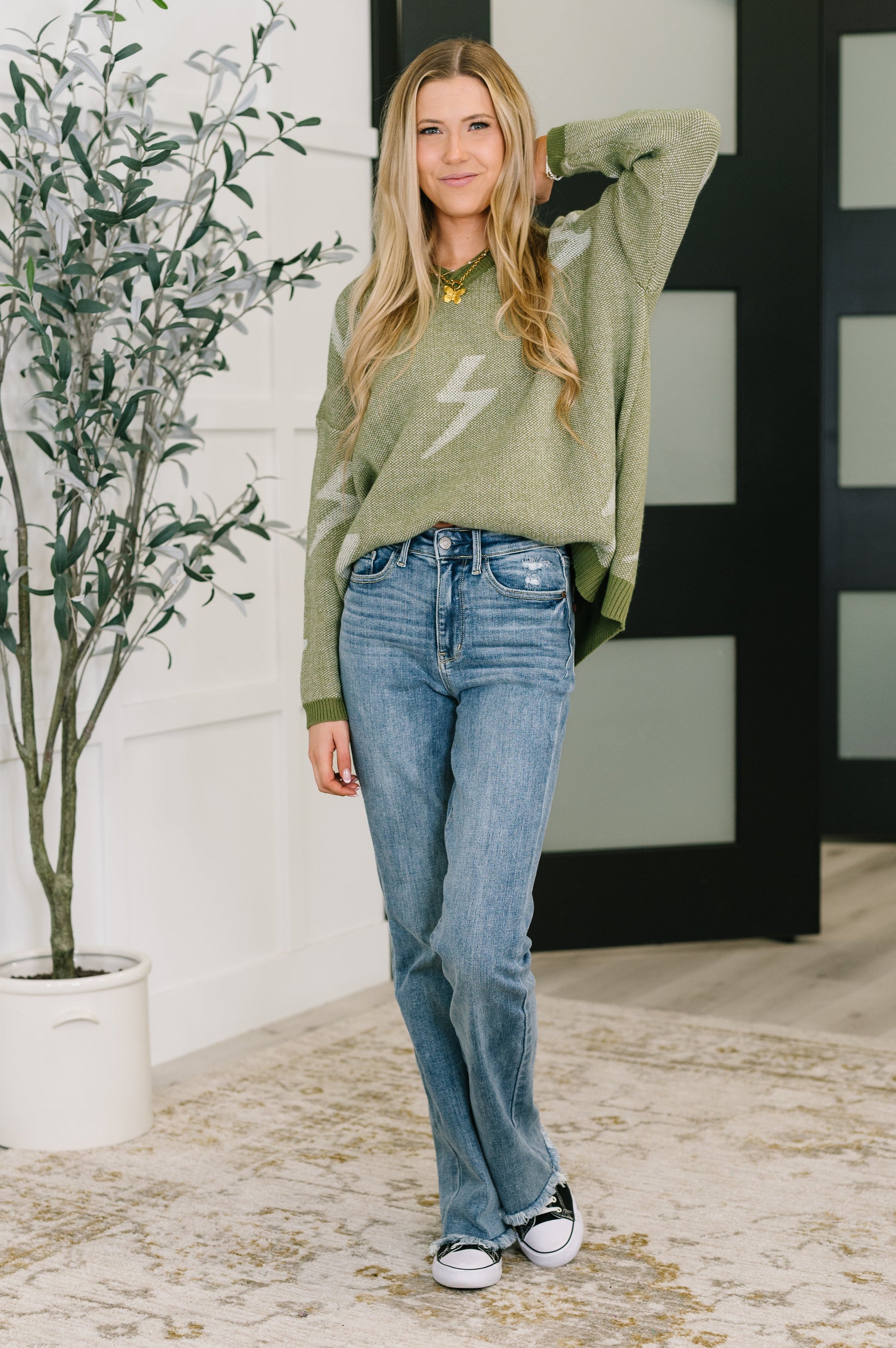 Olive green Shock Value V-neck sweater with white lightning bolt embroidery