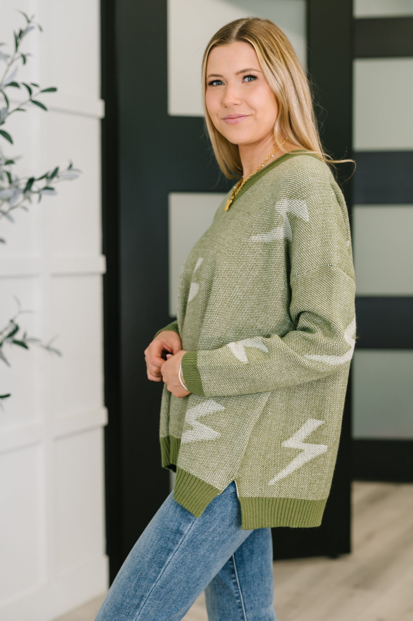 Olive green Shock Value V-Neck Sweater with white lightning bolt knit pattern