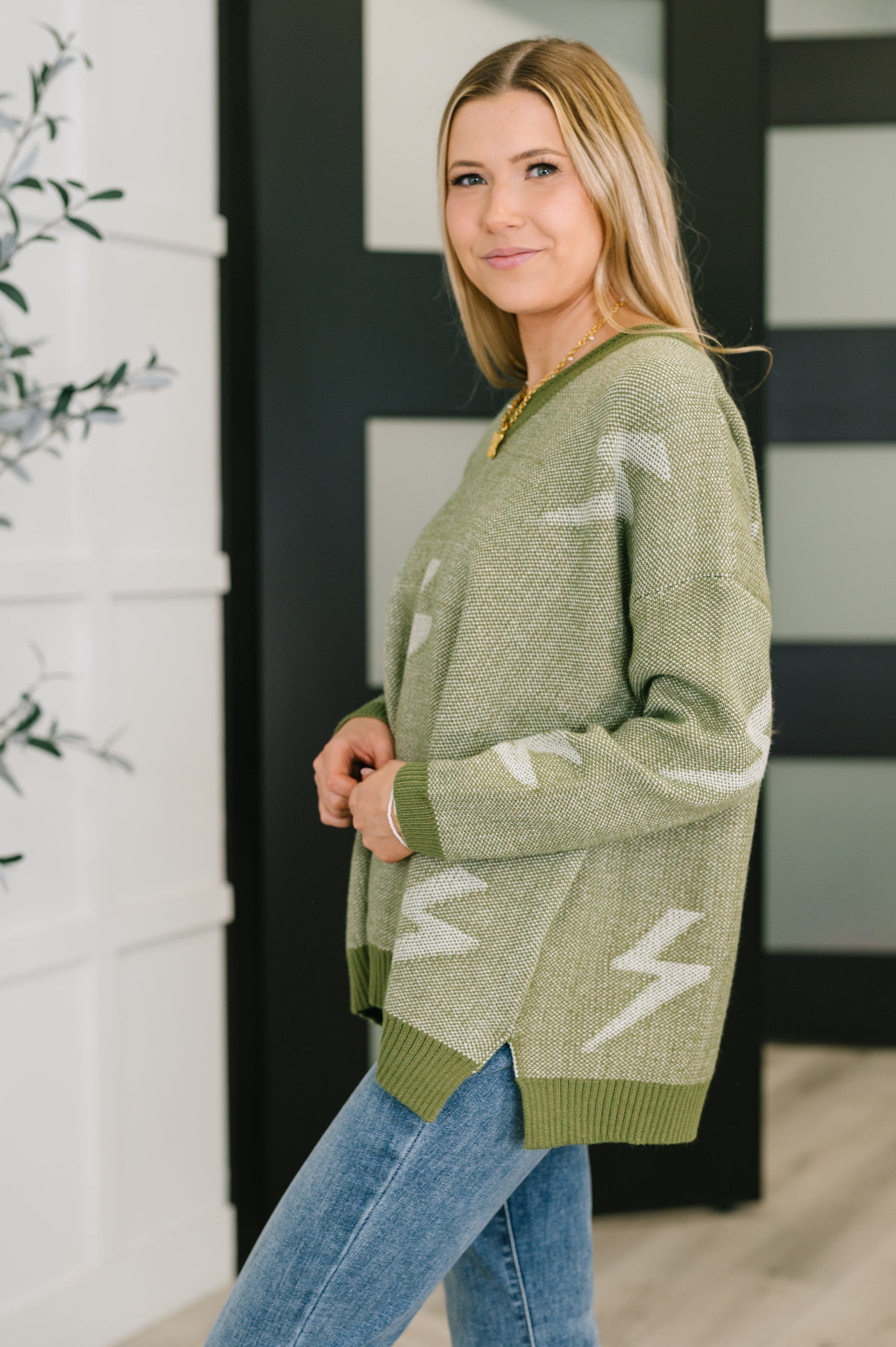 Olive green Shock Value V-Neck Sweater with white lightning bolt knit pattern