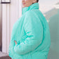 Bibi Mock Neck Puffer Jacket in mint green with quilted design and high collar