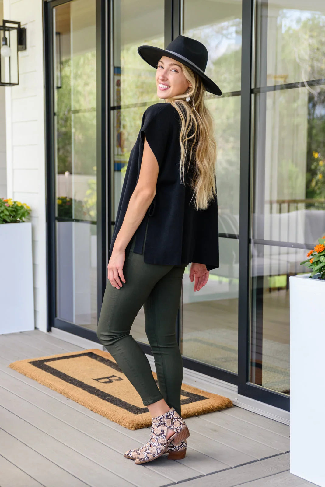 Andree by Unit black side tie tunic with olive leggings and snakeskin booties