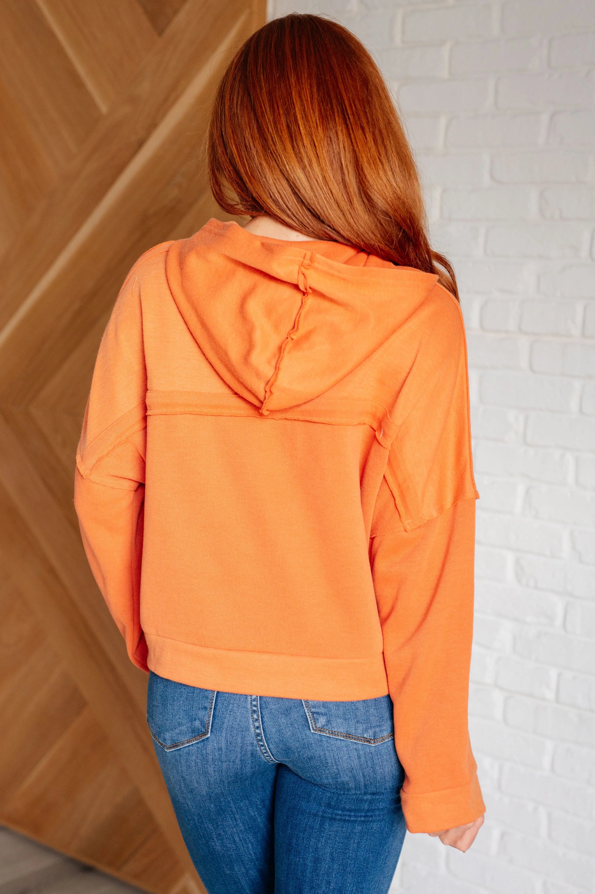 Orange Throwback Heartthrob Hoodie with drawstring hood and ribbed cuffs