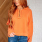 Orange Throwback Heartthrob Hoodie with button detail and hood