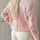 Soft pink cable-knit crewneck sweater with diamond back and ribbed cuffs