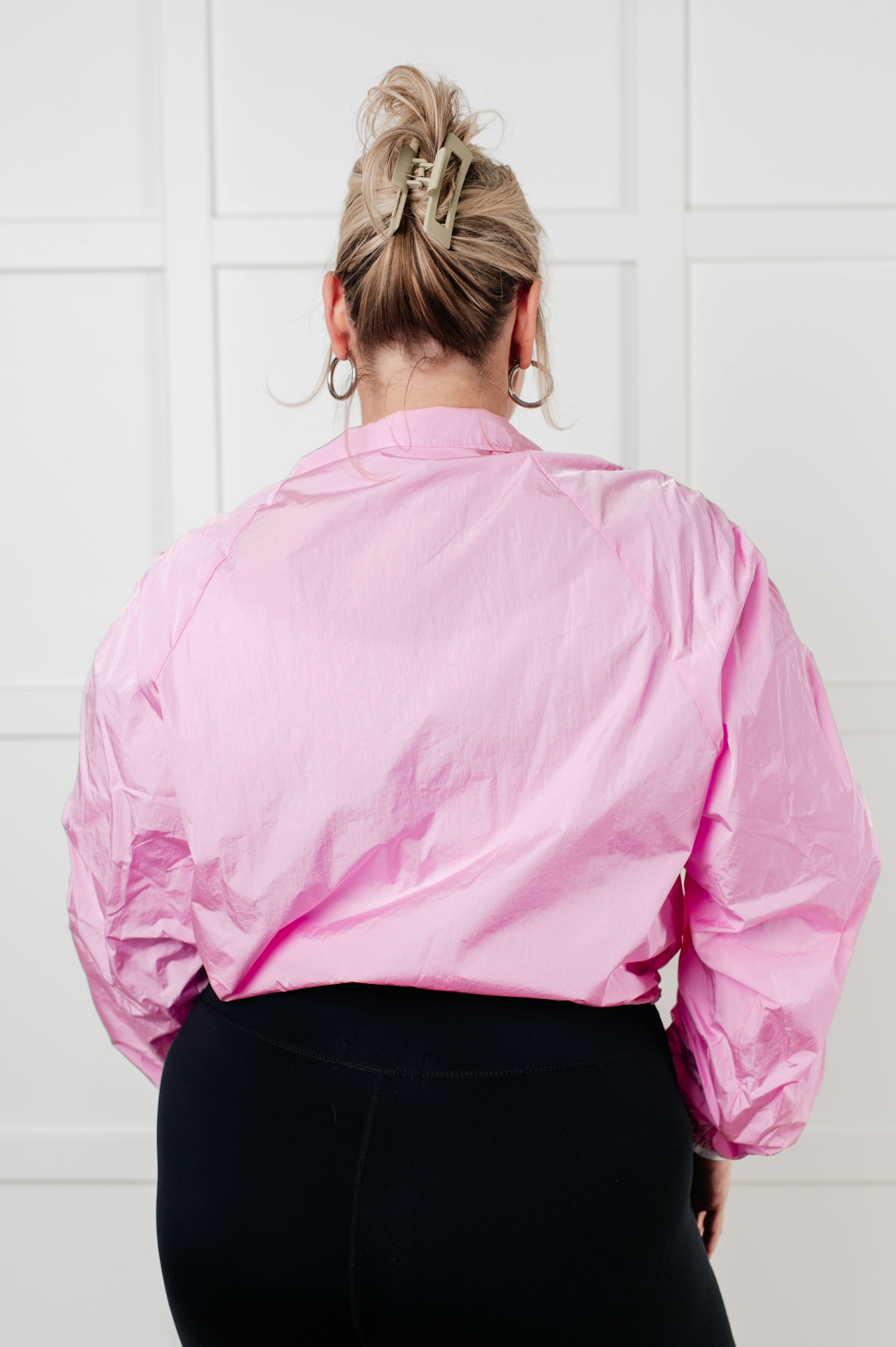 Pink satin bomber jacket with puffed sleeves and cropped hem