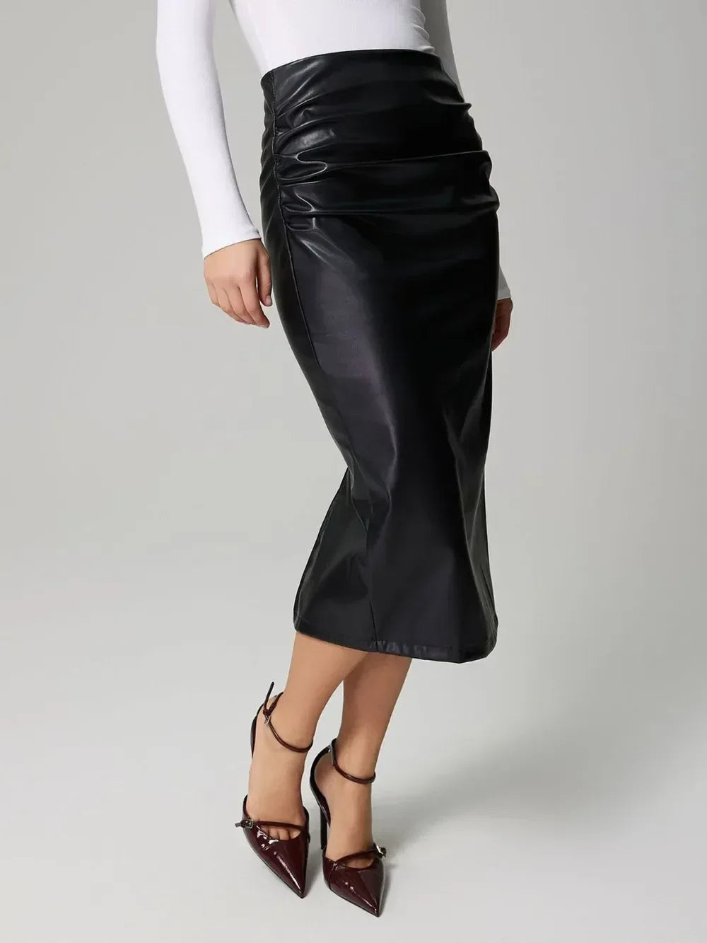 Faux Leather Slit Back Ruched Midi Skirt - DAVERRI FASHIONS