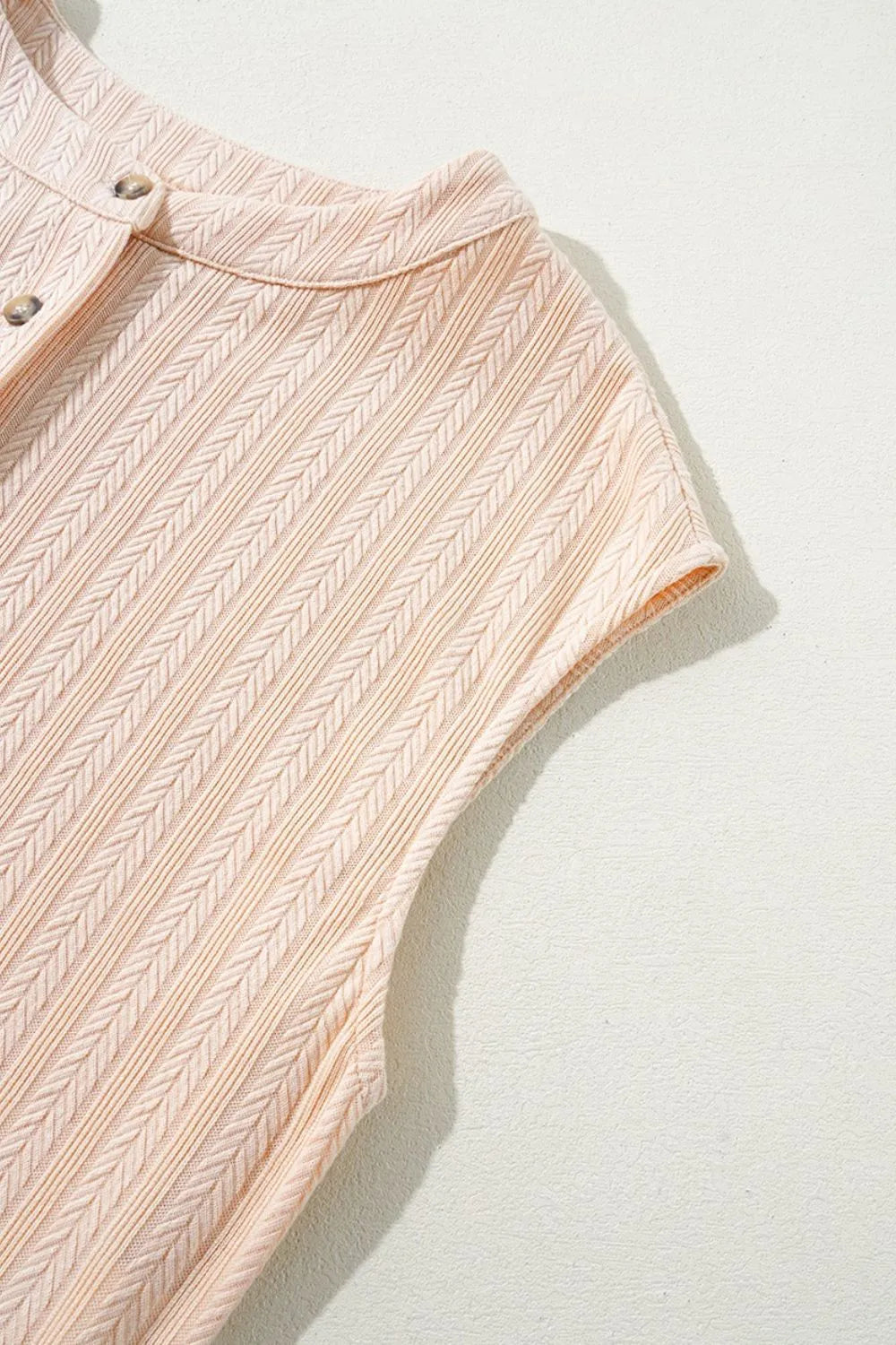 Daverri peach cap sleeve top with herringbone knit and metallic buttons