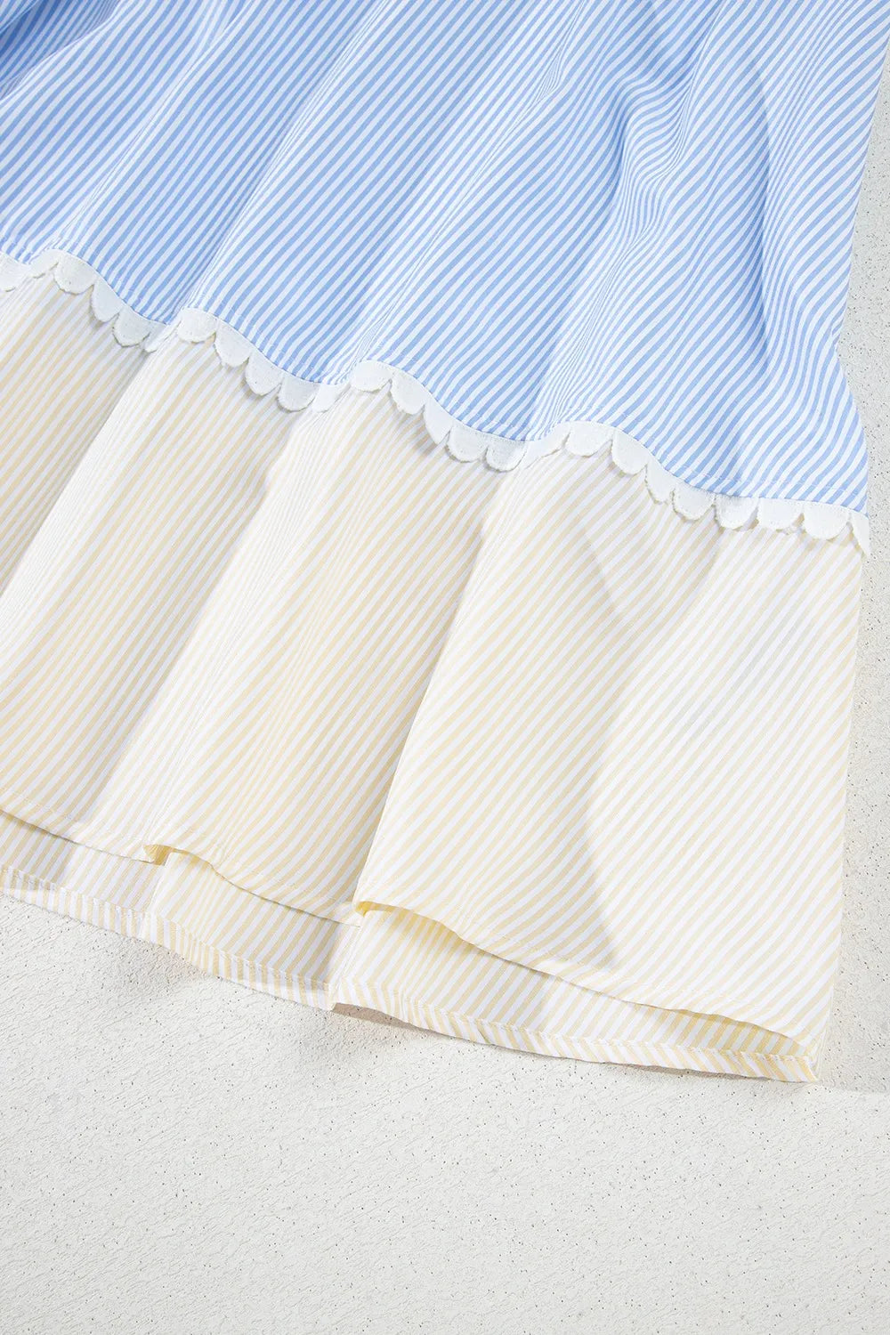 Striped patchwork ric rac puff sleeve collared mini dress in light blue and white stripes with off-white ribbed skirt and scalloped edges