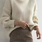 Cream-colored ribbed knit oversized turtleneck sweater, plus size