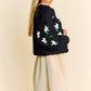 Black knit Davi & Dani cardigan with white green daisy embroidery