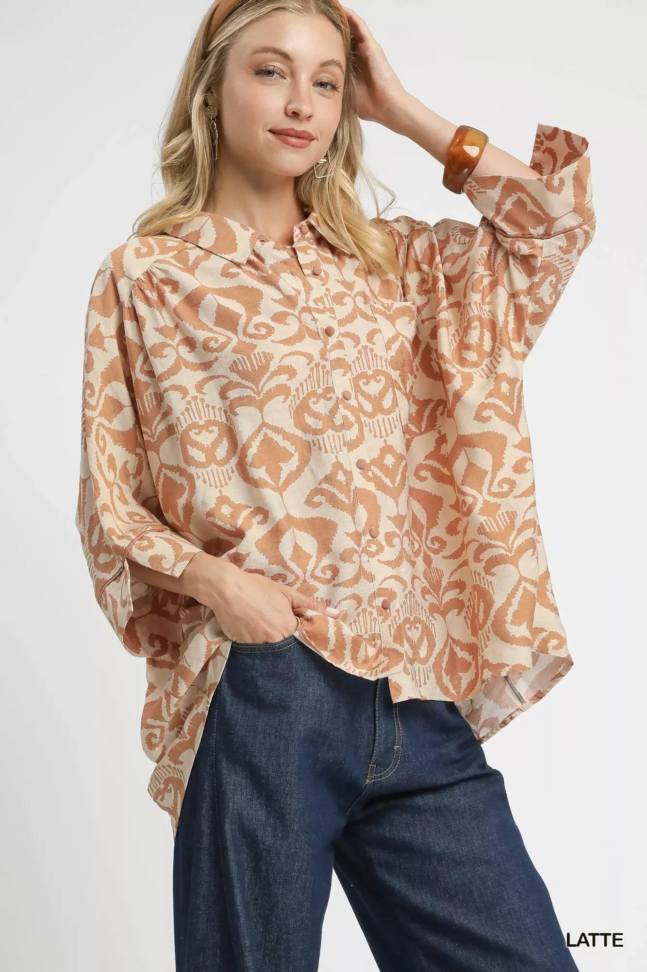 Umgee abstract print button-up oversized shirt in beige, brown, orange paisley with long sleeves and ruffled collar