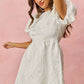 White textured mini dress with floral jacquard puffed sleeves and flared skirt