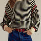 Black and white striped round neck long sleeve knit sweater with red trim