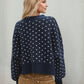Daverri navy blue knit sweater with white butterfly motifs and ribbed trim
