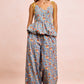 BiBi light blue floral jumpsuit with peplum waist and yellow tie straps
