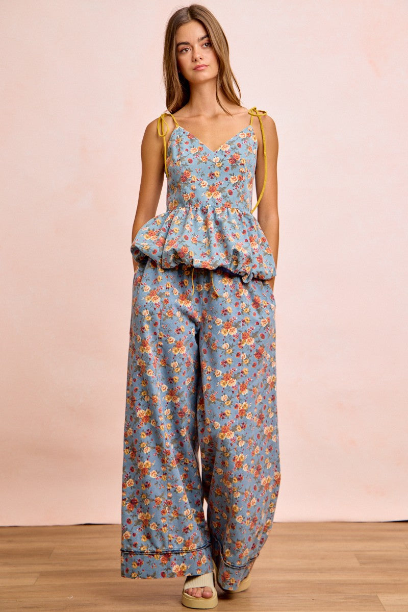 BiBi light blue floral jumpsuit with peplum waist and yellow tie straps