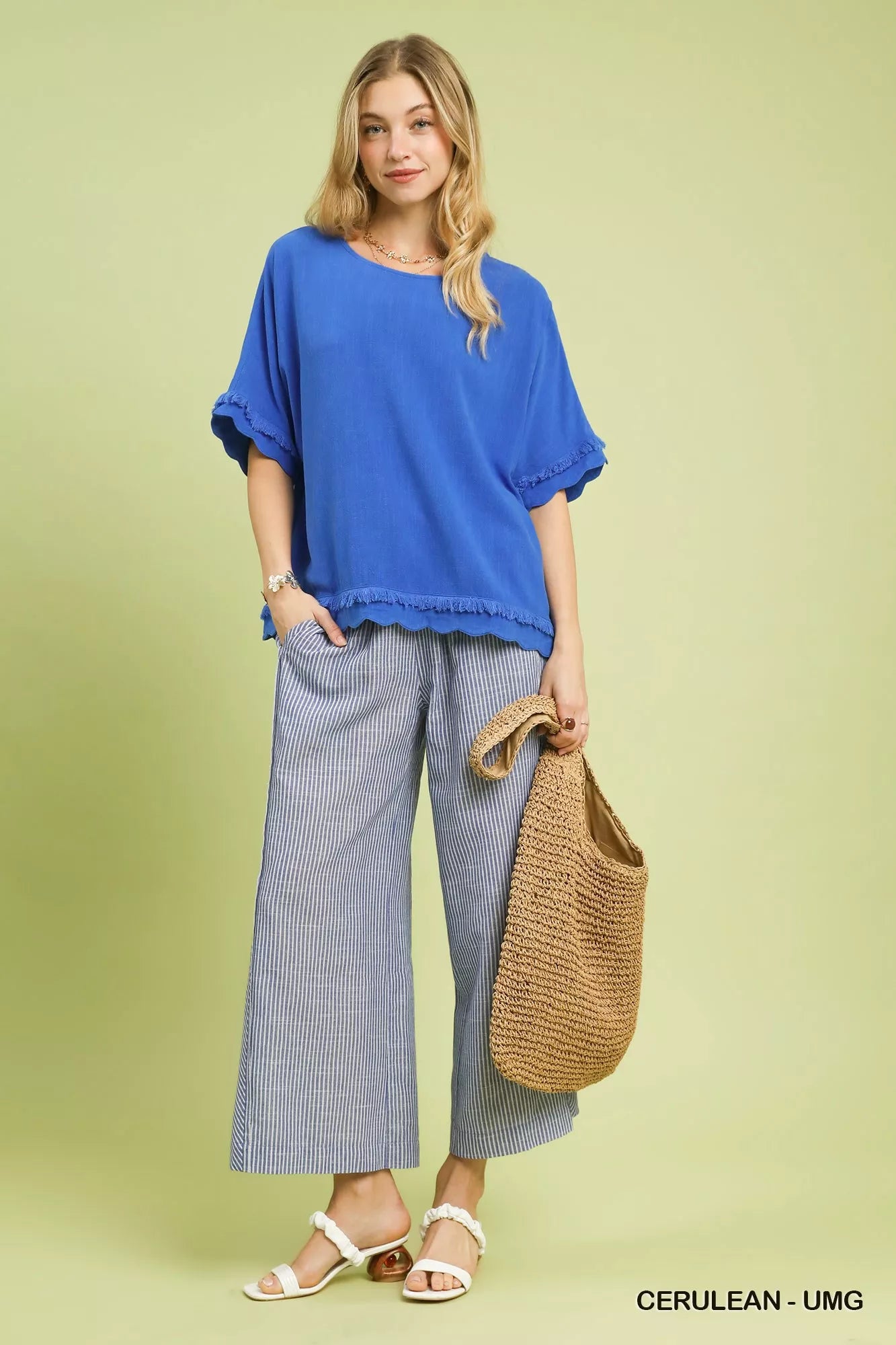 Vibrant cerulean Umgee linen top with ruffled sleeves and frayed hem