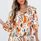 Yellow abstract print drawstring frilled V-neck 3/4 sleeve blouse on white background