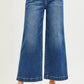 RISEN high rise wide leg jeans in blue denim with frayed hem and pockets