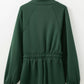 Dark green zip-up drawstring waist romper with high collar and long sleeves