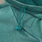 Teal drawstring hood with ribbed trim on women’s mineral wash baggy hoodie