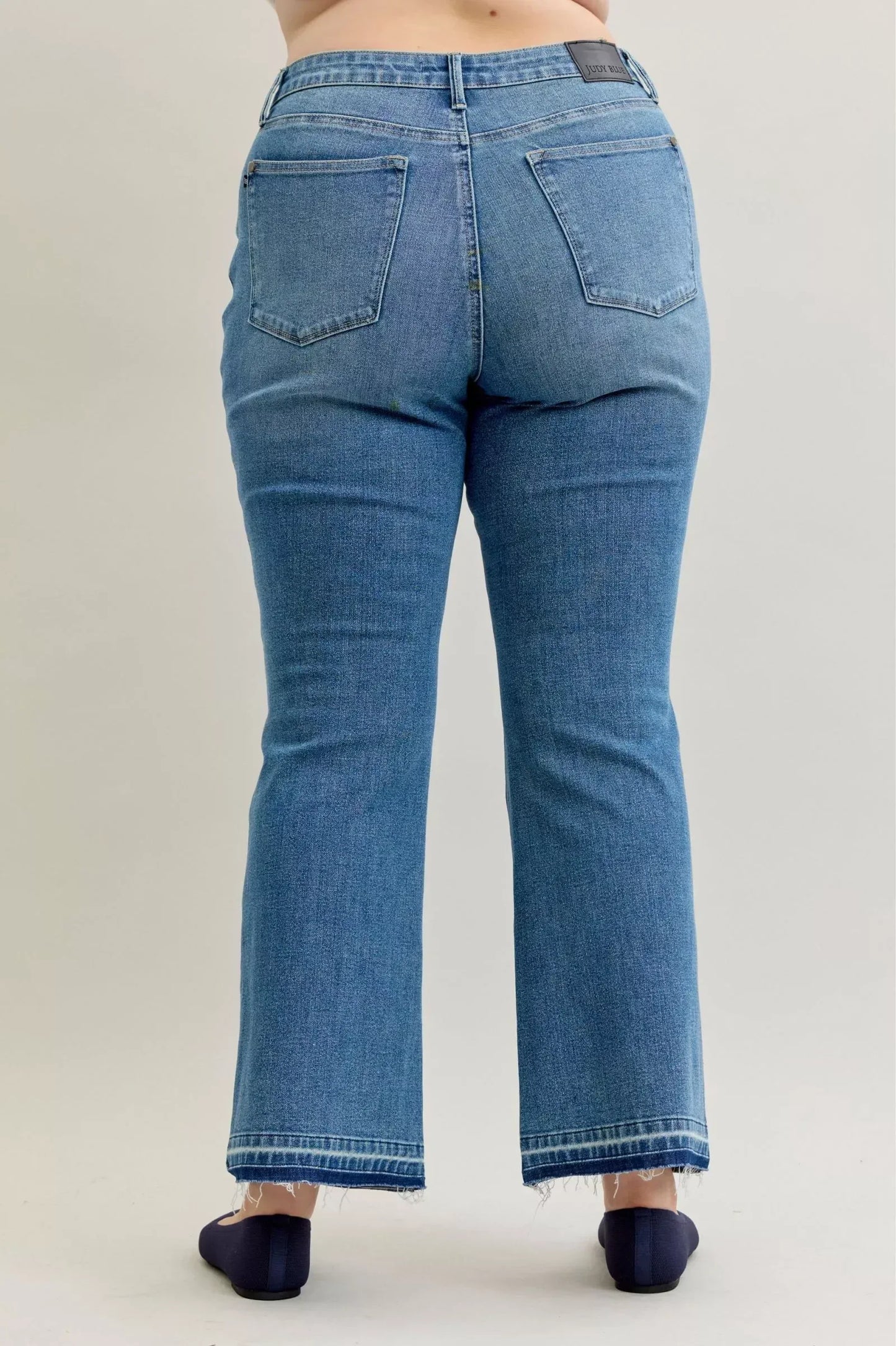 Judy Blue Full Size Mid Rise Slim Bootcut Tummy Control Release Hem Jeans Plus Size - DAVERRI FASHIONS