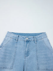 Light blue high-rise barrel relaxed denim shorts with button fly and patch pockets