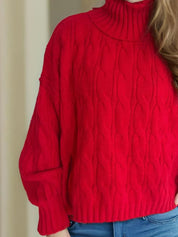 Red cable-knit turtleneck sweater with balloon sleeves
