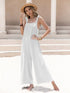 White sleeveless wide leg jumpsuit with tie shoulder straps and subtle embellishments