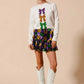 White long-sleeved sweater with purple, gold, green sequined bows for SO ME Mardi Gras skirt