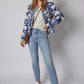 Blue and white floral bomber jacket with open front buttoned ribbed cuffs