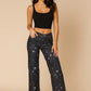 Women’s low rise rhinestone jeans with starry night sky print